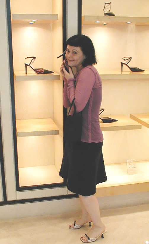 Gentry Lane Cuddling a Chanel Shoe