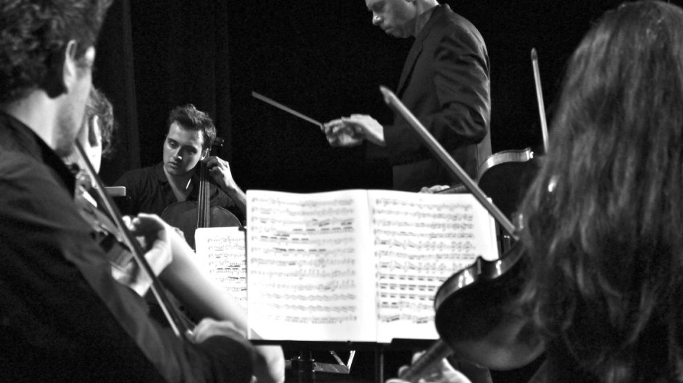 Sinfonietta musicians and conductor