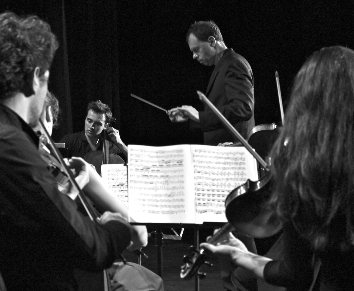 Sinfonietta musicians and conductor