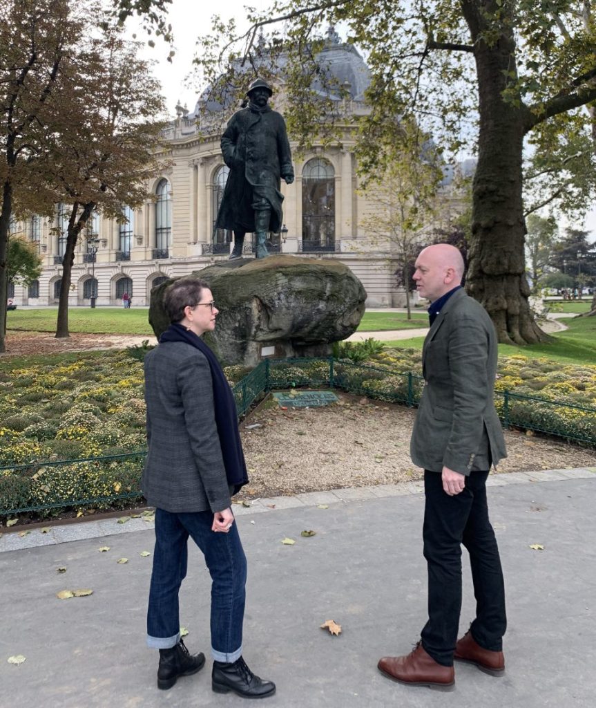 Author Yvonne Hazelton with historian Dr Nigel Perrin at the statue of Georges Clemenceau on the Chmpas-Elysées.