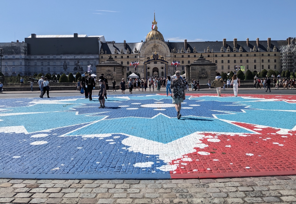The Bleuet de France symbol on the street in front of Les Invalides