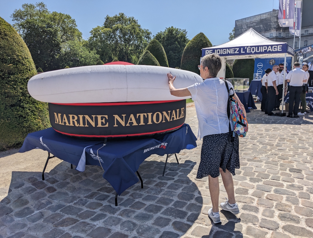 Touch the red pom-pom on the French Navy hat for luck