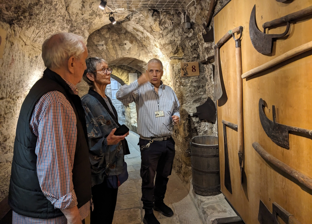 Tour guide Jean-Manuel explains some of the harvest tools at the Musée du Vin.