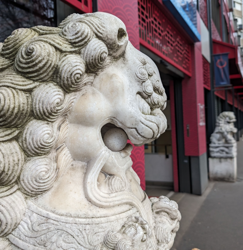 Statues guarding the entrance of Paris Store in Chinatown