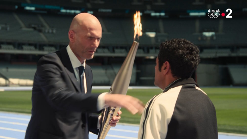 Zinedine Zidane takes the Olympic torch 