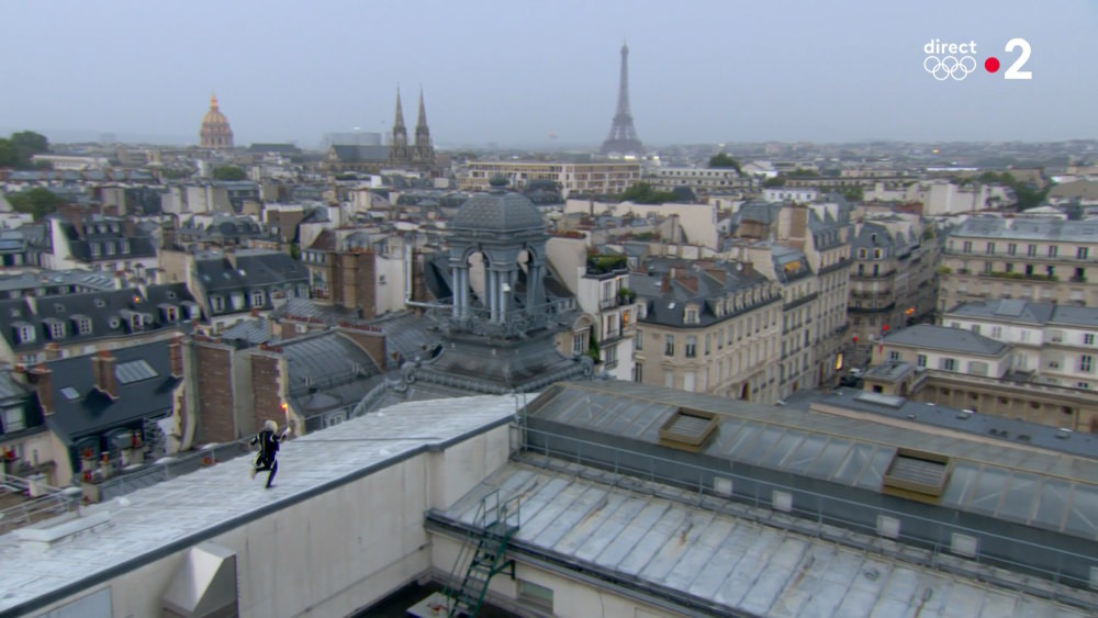 The hooded torch bearer on the roof of the Orsay