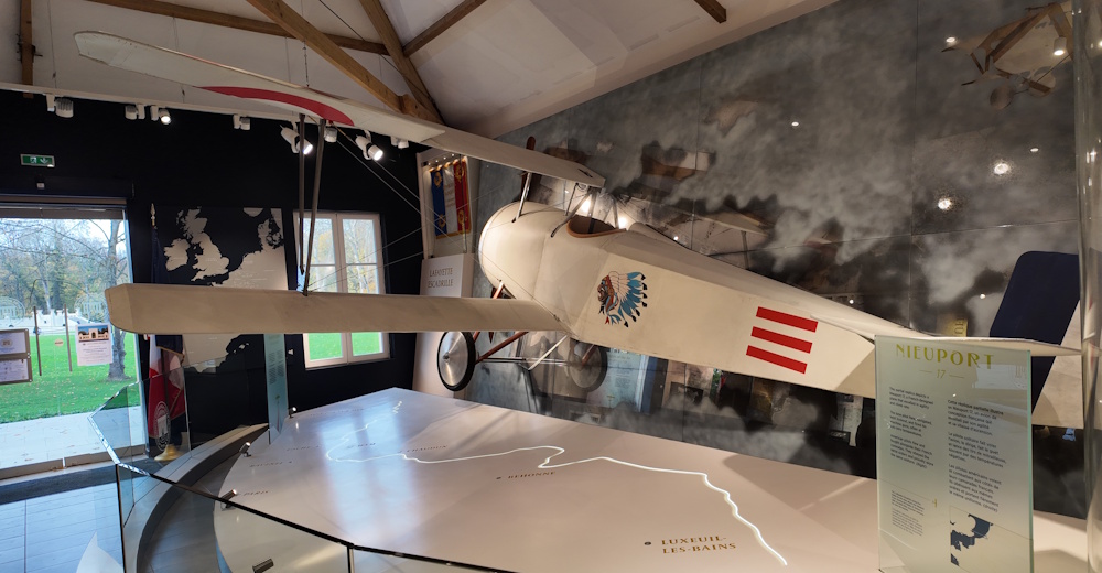 A WWI-era fighter plane with the Lafayette Escadrille insignia.