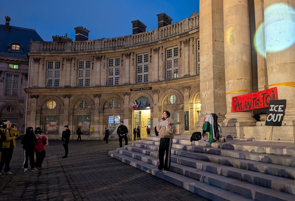 Protesting Peter Thiel's presence at the Institute de France in January 2026.